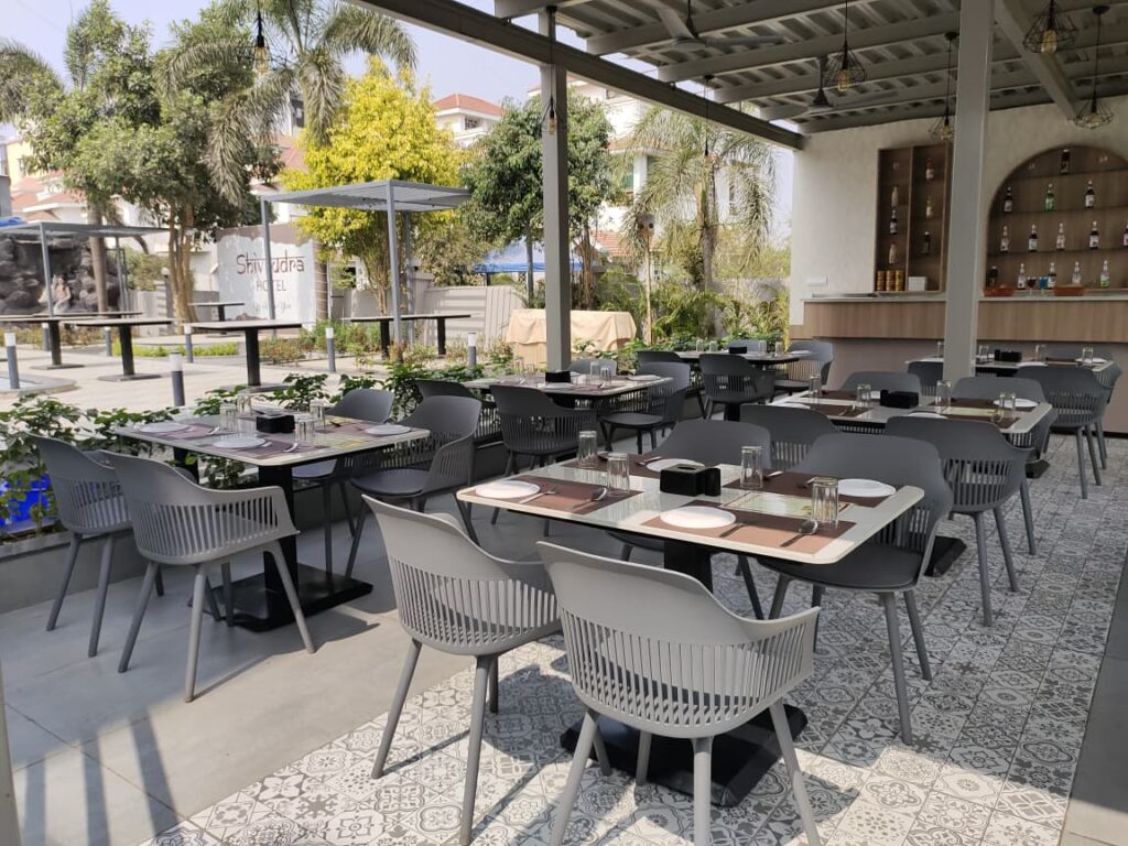 Outdoor restaurant seating area at Shivrudra Hotel Restaurant on Lohgaon–Wagholi Road, Lohegaon Pune, offering affordable veg and non-veg dining near Pune Airport