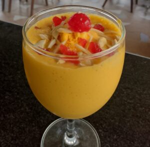 Mango mastani drink with ice cream and dry fruits at Pune restaurant