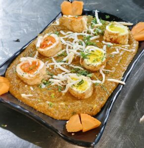 Paneer rajwadi curry served with egg topping at Shivrudra Hotel Pune